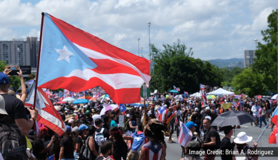 Puerto Rican flag and a crowd