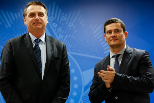 Bolsonaro and Sergio Moro stand side-by-side