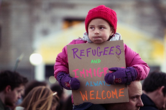 Child at a protest, refugees and immigrants