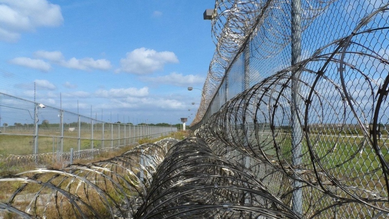 Exterior of a prison with barbed wire
