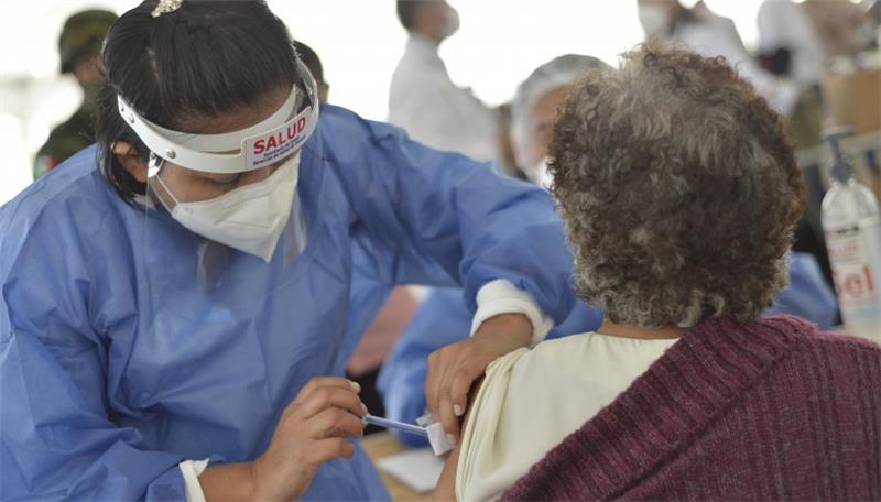 Nurse introducing a vaccine into patient