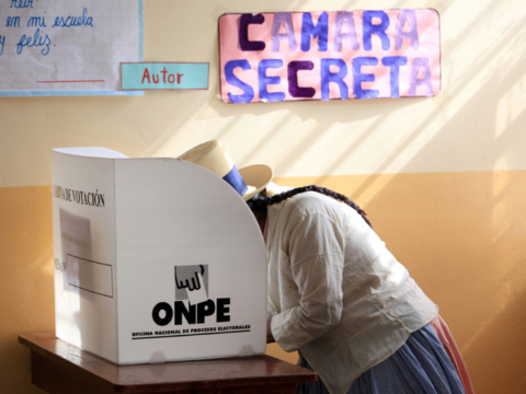 Woman voting in Peru
