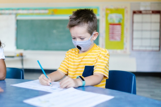 Boy at school with mask