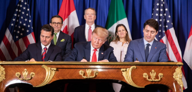 Photo of Enrique Pena Nieto, Donald Trump and Justin Trudeau signing the USMCA.