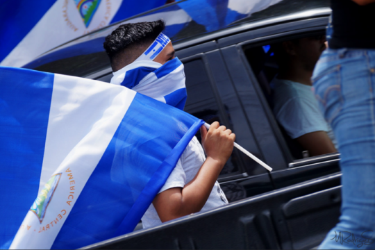 Photo of man holding Nicaraguan flag during 2018 protests